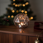 Geometric copper candle holder in a vintage Christmas scene